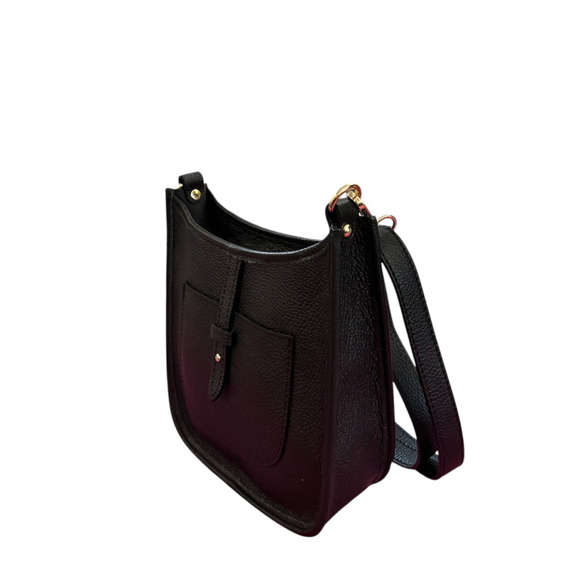 Black leather handbag with gold hardware on a white background